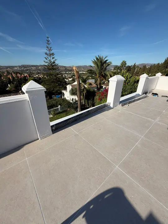 Glass balustrade on a roof terrace with views