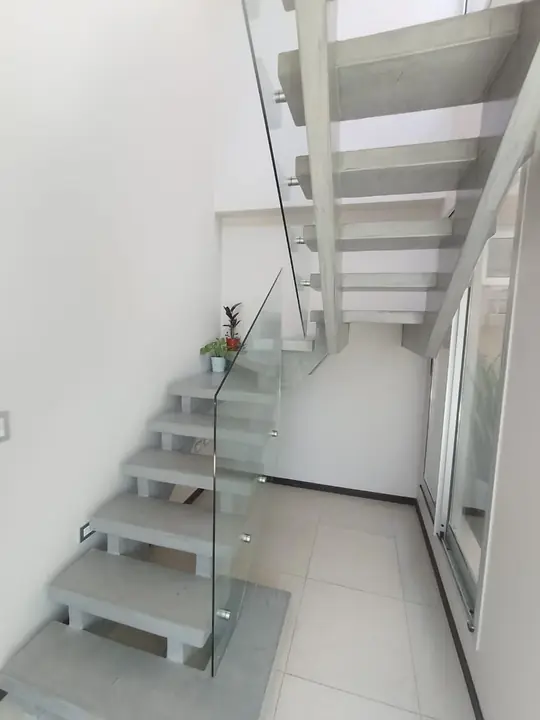 Floating staircase with a toughened glass balustrade