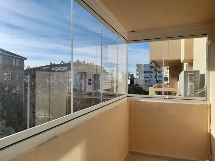 Panoramic glazing on a corner terrace with views