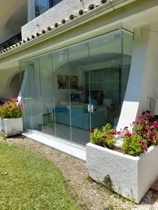 Panoramic glazing on a villa with a garden