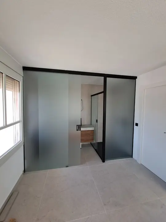 Frosted glass partition with a black profile