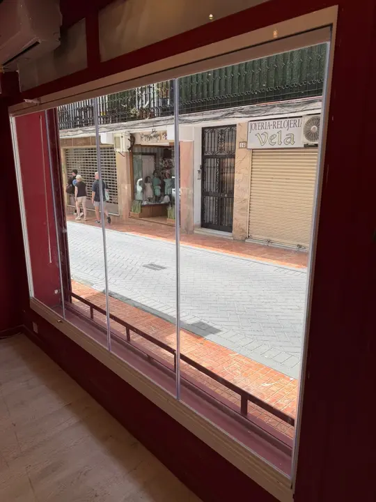 Shopfront with folding glass panels open to the street