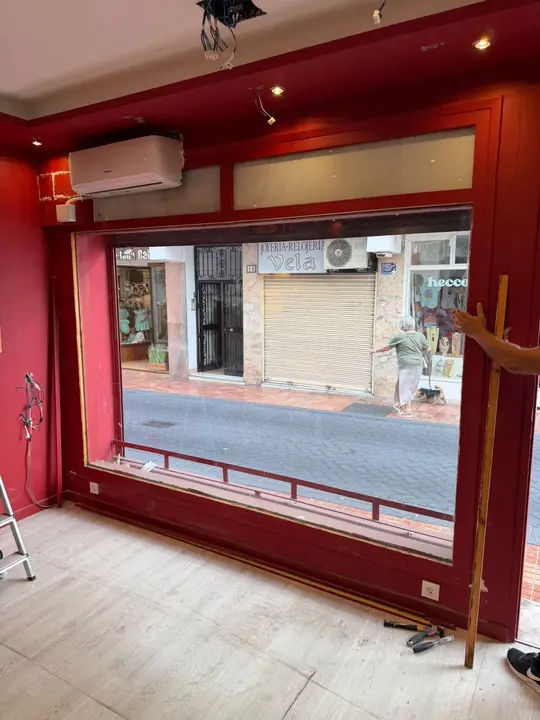 Glass shopfront seen from inside the premises