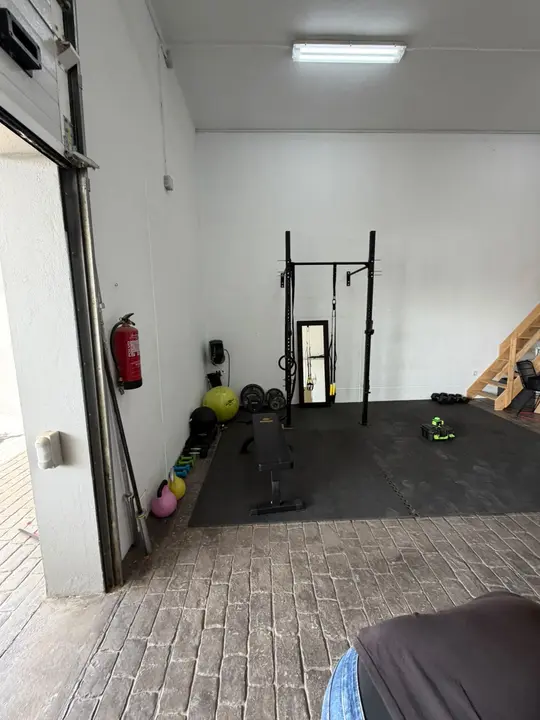 Made-to-measure mirror in a private gym beside the training area