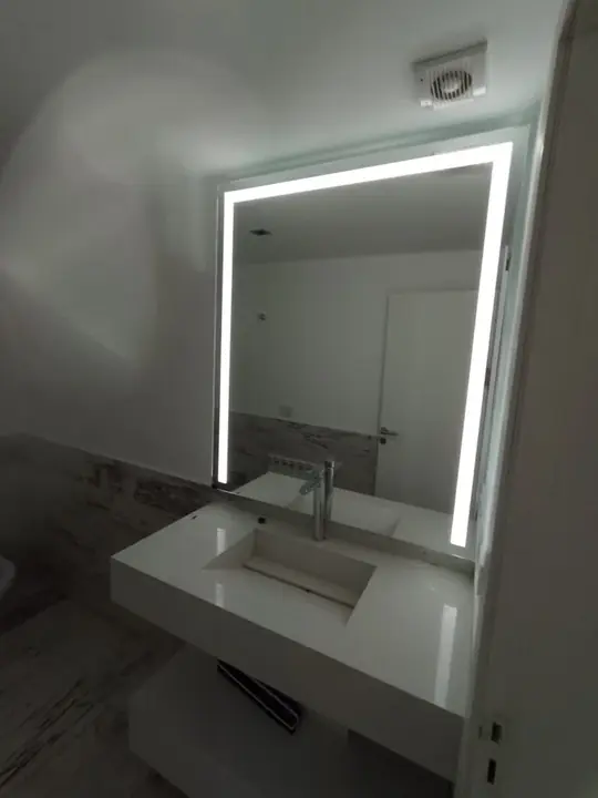 LED mirror with a light frame in a modern bathroom
