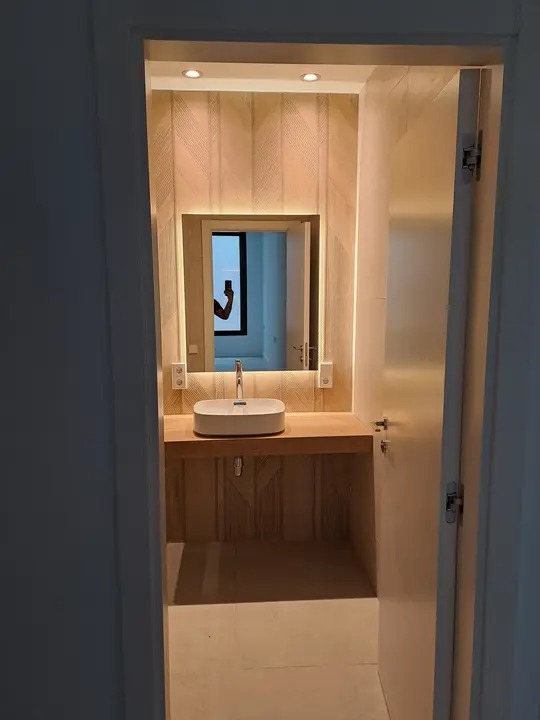 LED mirror in a wooden niche