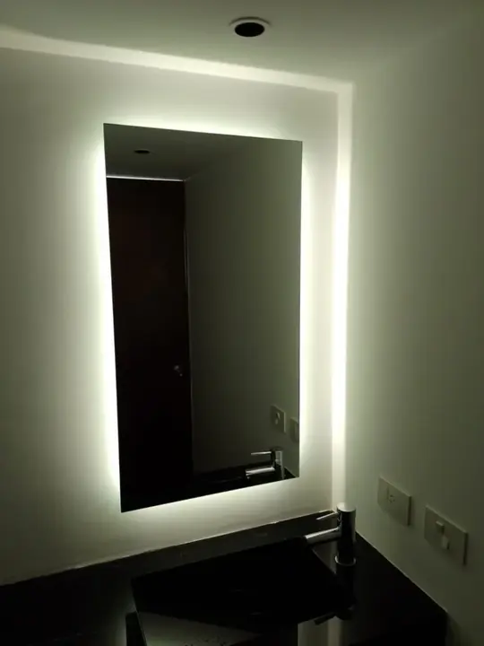 Rectangular backlit mirror with perimeter LED lighting