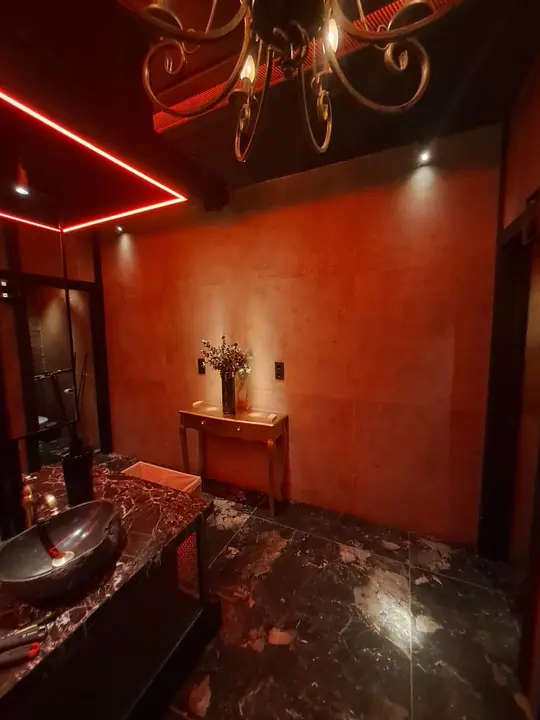 Marble washbasin with a mirror in a restaurant cloakroom