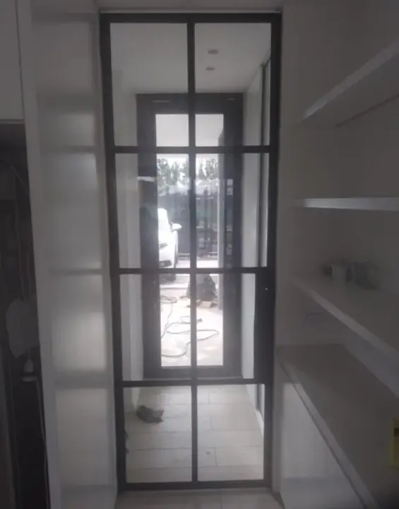 Industrial-style glass door with black profiles