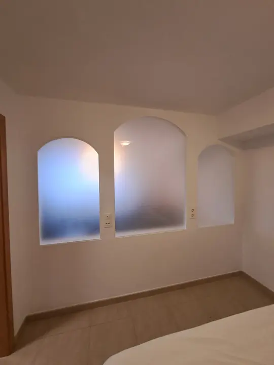Arched interior windows with frosted glass